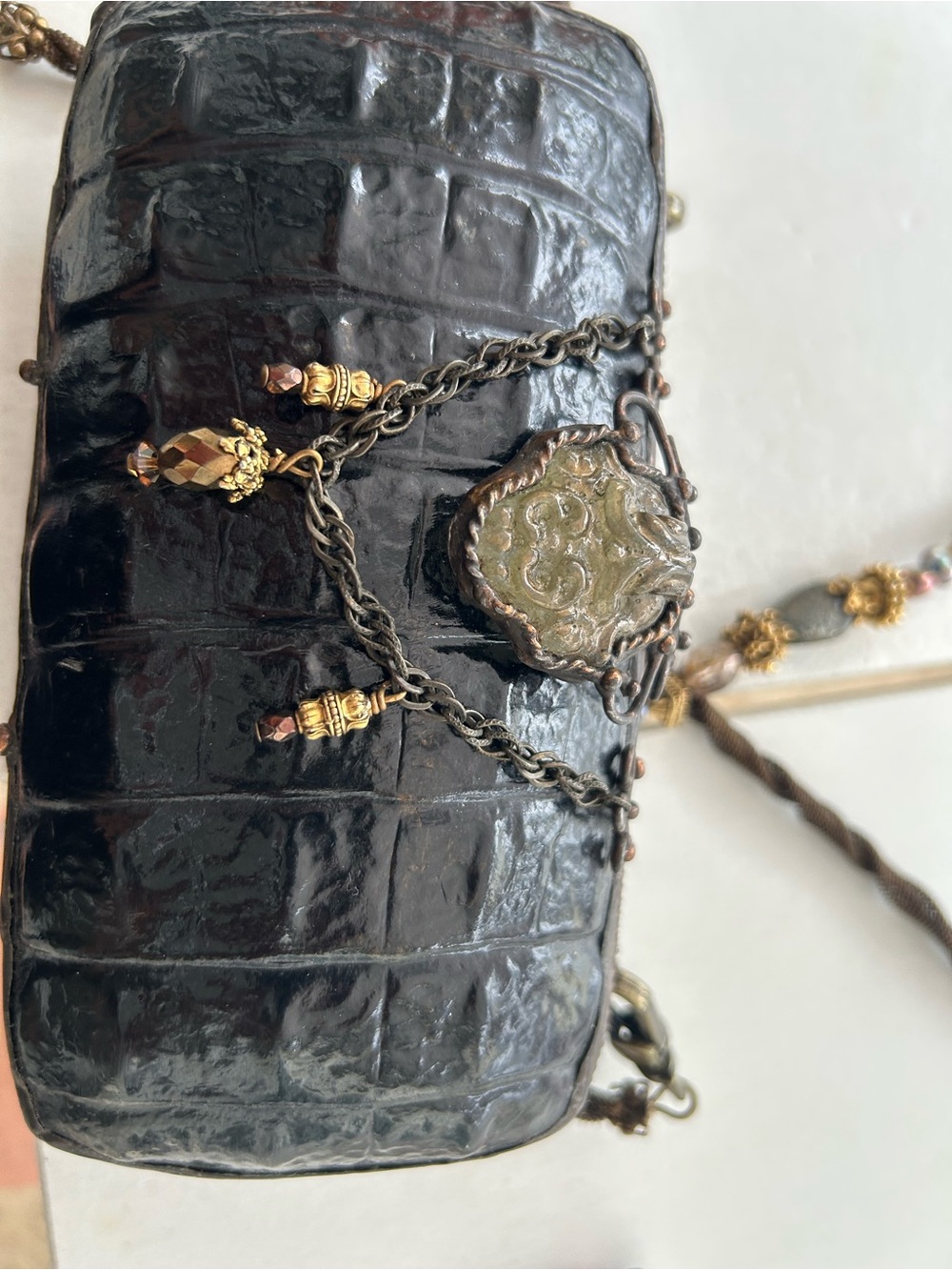 vintage Maya Evangelista black faux crocodile patterned hard-body evening bag.